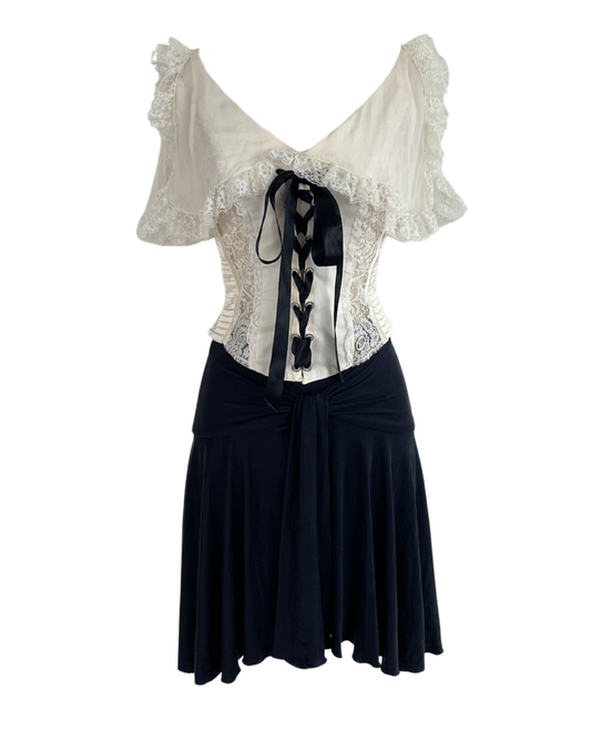 Valentino Spring Summer 2004 runway Look 2 ivory lace-trimmed corset and deep navy skirt, an example of a documented runway piece at The Rareté