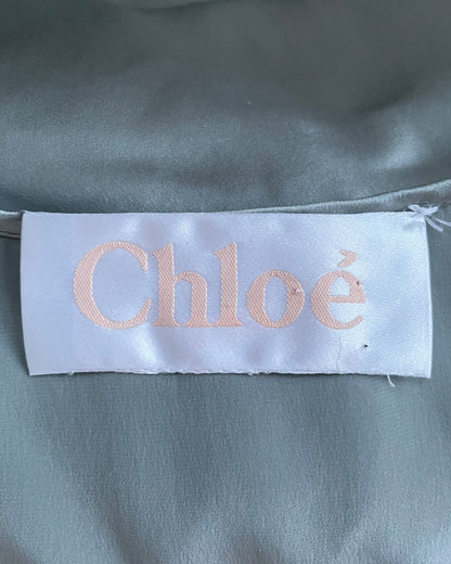 Interior Chloé brand label sewn into gray-blue silk fabric